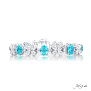 Paraibas alternating between pear shaped and round diamonds.